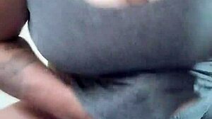 watch this tattooed brunette wife fuck her huge dildo with titties