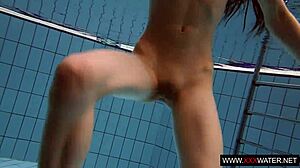 long-haired brunette cutie janka teases underwater in public pool shower