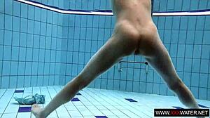 long-haired brunette cutie janka teases underwater in public pool shower