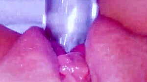 CURIOUS COED SQUIRTS HUGE ON GLASSTOY DILDO