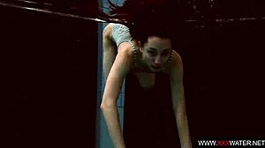 long-haired brunette cutie janka teases underwater in public pool shower