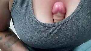 watch this tattooed brunette wife fuck her huge dildo with titties