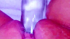 CURIOUS COED SQUIRTS HUGE ON GLASSTOY DILDO