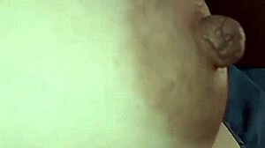 Nipple fills the frame in tight piano close-up