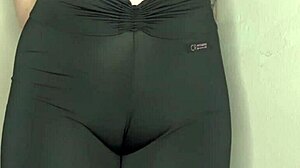 She whispers ASMR while cameltoe bulges tight black leggings