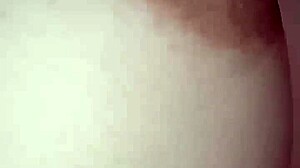 Nipple fills the frame in tight piano close-up