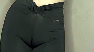 She whispers ASMR while cameltoe bulges tight black leggings