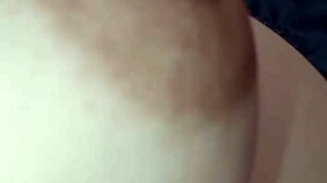 Nipple fills the frame in tight piano close-up