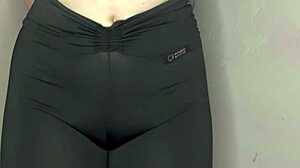 She whispers ASMR while cameltoe bulges tight black leggings
