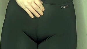 She whispers ASMR while cameltoe bulges tight black leggings