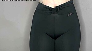 She whispers ASMR while cameltoe bulges tight black leggings