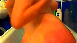 Tattooed model fingers pussy glass dildo bathroom webcam