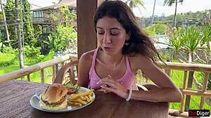 A Cute Brunette Teen Eats Burger Dripping Cum on Face at Public Cafe Cumwalk