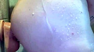 Peterwolfe Shoves Huge Pierced Dildo Deep in Shower Session