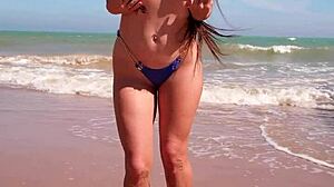 Tanned Petite Brunette Dances In Blue Bikini On Beach