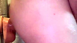 Peterwolfe Shoves Huge Pierced Dildo Deep in Shower Session