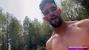 muscular guy jerks monster cock naked in forest