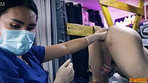 Dominafire's nurse stretches slave ass in latex rectal exam