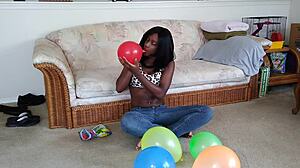 Watch ebony fetish babe inflate huge balloons french style!