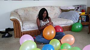 Watch ebony fetish babe inflate huge balloons french style!