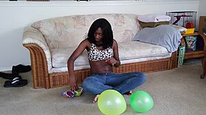 Watch ebony fetish babe inflate huge balloons french style!