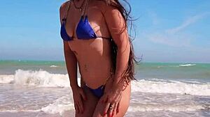 damn petite tanned neighbor flashes blue bikini pussy on crowded beach