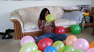 Watch ebony fetish babe inflate huge balloons french style!