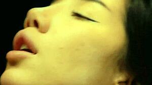 This naughty asian babe cums hard from doggystyle pounding