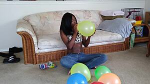 Watch ebony fetish babe inflate huge balloons french style!
