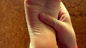 girl slowly lotions her soft feet
