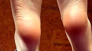 girl slowly lotions her soft feet