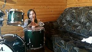 Petite teen rams huge dildo deep in pussy on drumset solo.