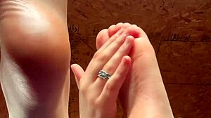 girl slowly lotions her soft feet