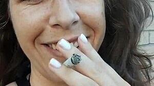 Kelly Kendricks Smokes Clothed with Deep Brunette Cleavage Outdoors