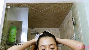 Adorable brunette teen showers in steamy bathroom solo