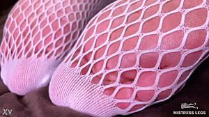 goddess teases lover's cock with cute white fishnet feet bed closeup