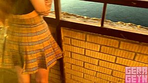 Smoking brunette gives fast public balcony blowjob close-up