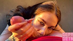 Smoking brunette gives fast public balcony blowjob close-up