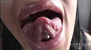 Angelina Valentine packs her tight holes with huge dildos.