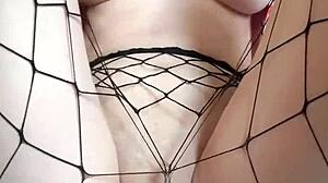 innocent tattooed girl rubs big dildo on pantyhose to cum