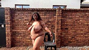 SA Colored BBW Smokes Chain Cigarettes Naked in Garden Flaunting Huge Natural Tits