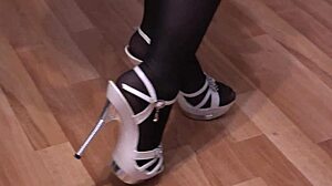 brunette milf in stockings masturbates feet fetish with shoes at home