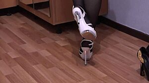 brunette milf in stockings masturbates feet fetish with shoes at home