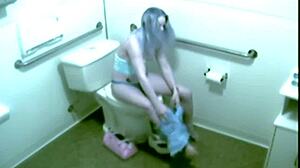 petite blonde office babe caught fingering shaved pussy on hidden cam toilet spy
