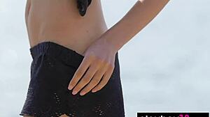 petite sade mare strips her tight shaved pussy on the beach