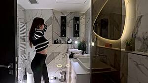 imagine tall brunette secretary in glasses lifting skirt in office bathroom