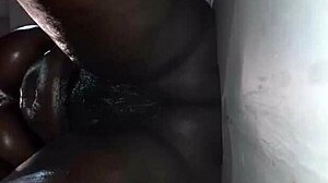 Ebony MILF bends over gloryhole for BBC anal pounding