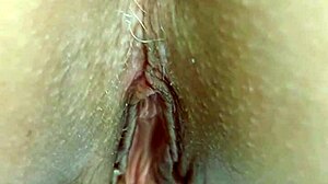 Horny mature wife massages huge meaty shaved pussy lips!