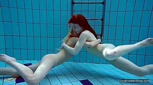 Two hot lesbians tease underwater pool secrets