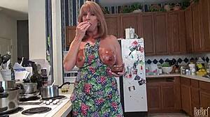 Mature housewife raehart pleasures kitchen duties with huge tits